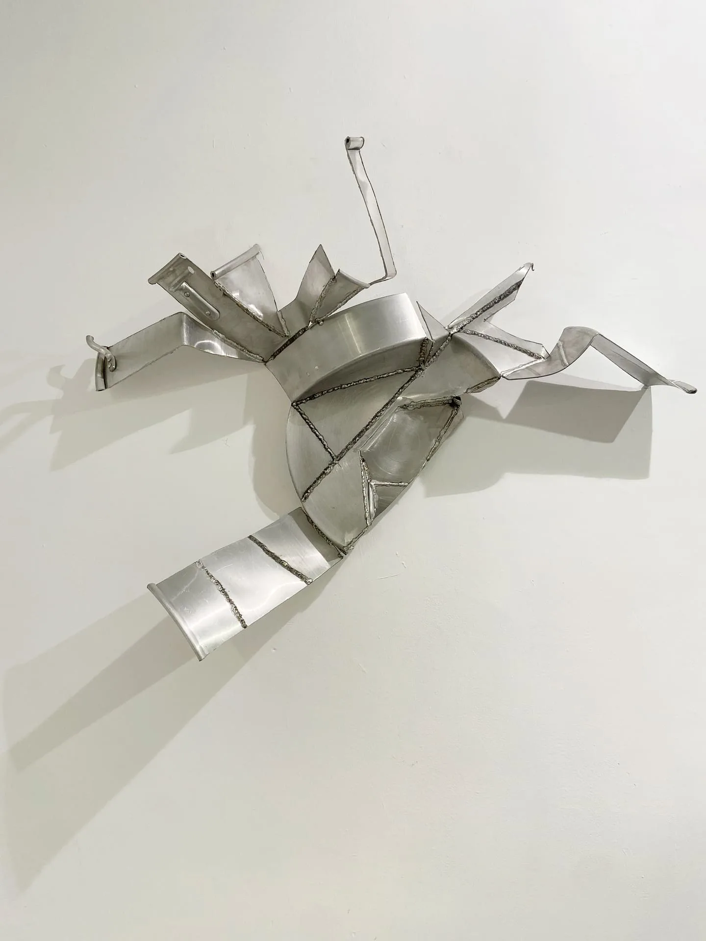 Yaara Zach, Untitled, 2022, welded aluminum pots, 110x130x27 cm